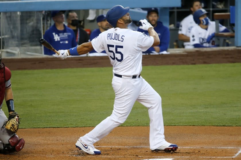 LOS ANGELES, CA - MAY 17: Los Angeles Dodgers first baseman Albert Pujols (55) flies out to the outfield against the Arizona Diamondbacks starting pitcher Madison Bumgarner (40) in the first inning at Dodger Stadium on Monday, May 17, 2021 in Los Angeles, CA. (Gary Coronado / Los Angeles Times)