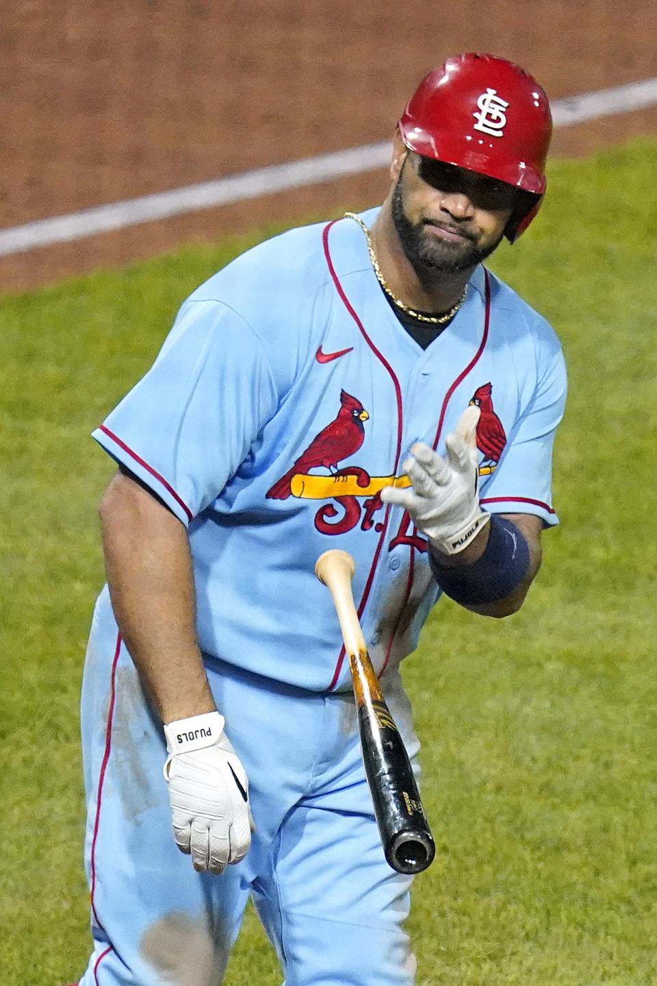 St. Louis Cardinals' Albert Pujols tosses his bat after hitting a two-run home run off Pittsburgh Pirates starting pitcher JT Brubaker during the sixth inning of a baseball game in Pittsburgh, Saturday, Sept. 10, 2022. (AP Photo/Gene J. Puskar)