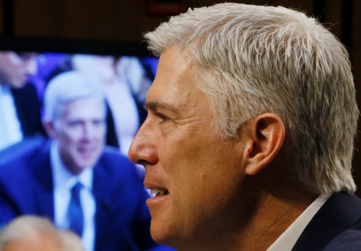 U.S. Supreme Court nominee judge Neil Gorsuch is seen on a video monitor as he testifies. 