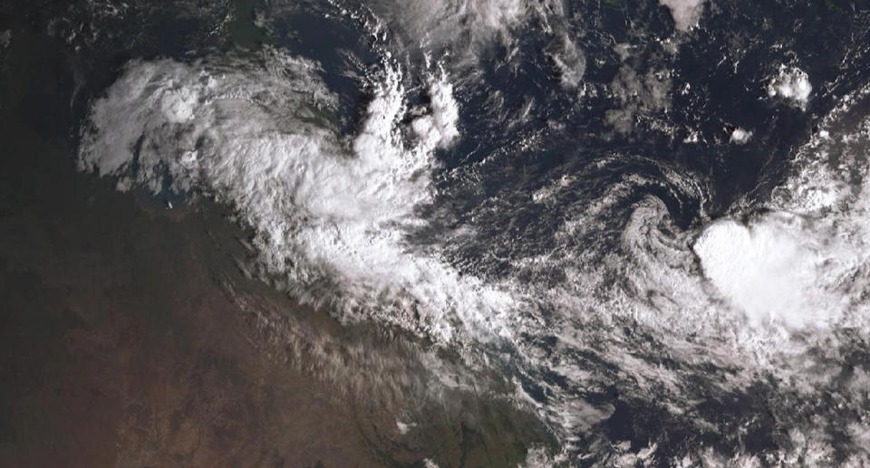 A satellite view of ex-cyclone Owen which is dumping heavy rain in Queensland’s far north and could reform into a cyclone by the middle of the week.