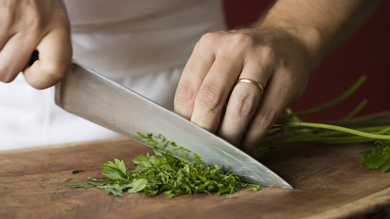 chef chopping parsley