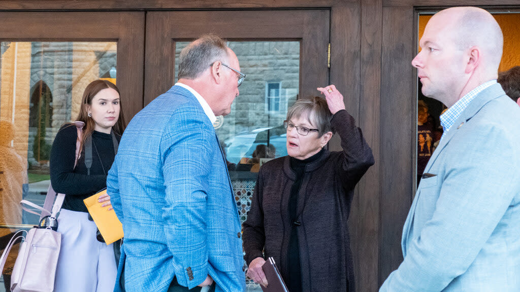 Gov. Laura Kelly talks with Sen. Jeff Longbine during a visit April 25, 2024, to Emporia