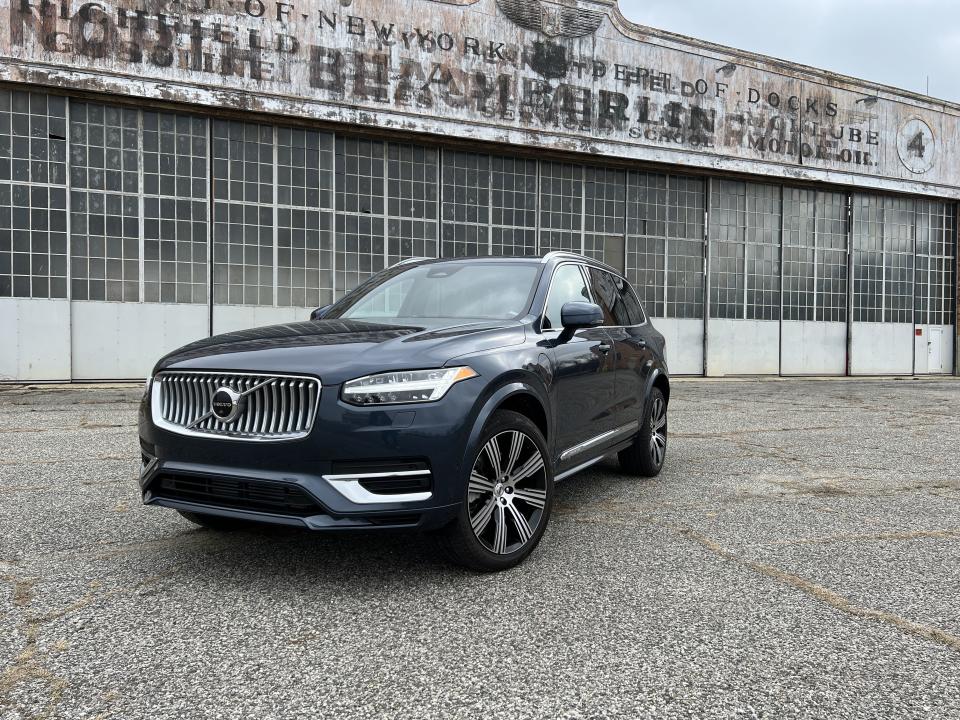 <p>The current Volvo XC90 has been in production since late 2014, though you wouldn't know it by driving it. </p><p>The Swedish carmaker's three-row SUV remains one of the most pleasant, classy options in the luxury segment. The looks haven't really evolved, but it's better that way. The design is the opposite of busy, yet still easily recognizable as a Volvo. </p><p>The plug-in hybrid drivetrain brings the rest of the car into the modern age, with over 30 miles of pure electric range and an impressive combined EPA rating of 66 MPGe. There are a few things that could be improved upon, however, like the sudden surge of torque that arrives when the car goes from pure EV to hybrid mode. There's also the braking, which can be a bit finicky at low speeds as it tries to recoup as much energy as possible. </p><p>That stuff mostly goes out the window when you mash the throttle pedal, as the XC90 Recharge is seriously quick in a straight line. That hybrid drivetrain delivers 455 hp and 523 lb-ft of torque, allowing for a 0-60 time of just 4.5 seconds. That's real sports car speed. </p><p>Despite its age, the interior still stands out as one of the best in the business. The dash and center console are minimalistic yet easy to use, while the seats are downright perfect. We're especially big fans of the wool blend upholstery—proof that not every luxury car has to use leather to feel upscale. </p><p>Factor in the comfortable four-corner air suspension, smooth steering, ample cargo space, and sub-$80,000 base price, and the XC90 remains a solid choice in the three-row luxury SUV segment. </p>