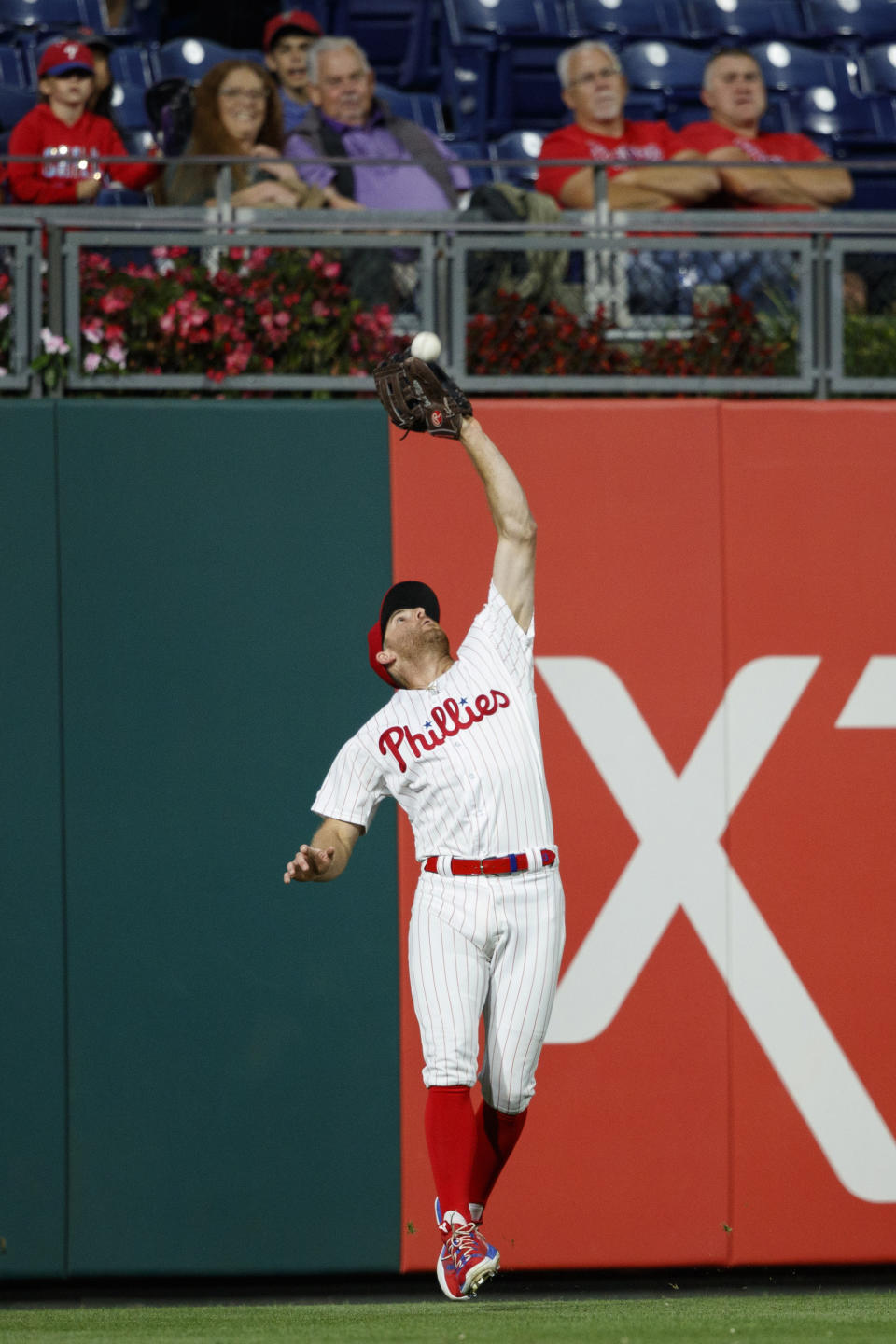 Philadelphia Phillies left fielder Brad Miller catches a fly out by Miami Marlins' Pablo Lopez during the fourth inning of a baseball game, Friday, Sept. 27, 2019, in Philadelphia. (AP Photo/Matt Slocum)