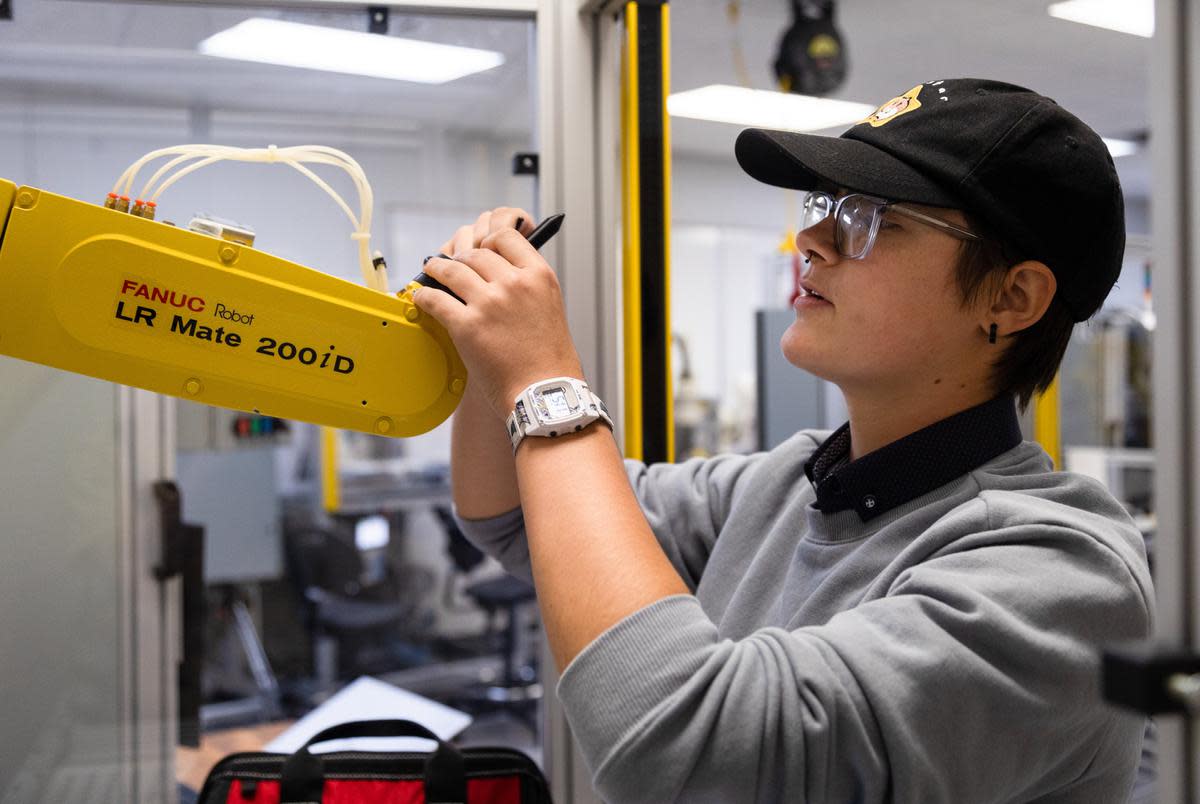 Jule Preiser, a fourth-semester Robotics student at the Texas State Technical College in Waco, works on a troubleshooting assignment during class on Oct. 24, 2022. Students were given no specific instruction - much like how you might be given a problem if out in the field - and tasked with finding a solution through their own problem solving skills.