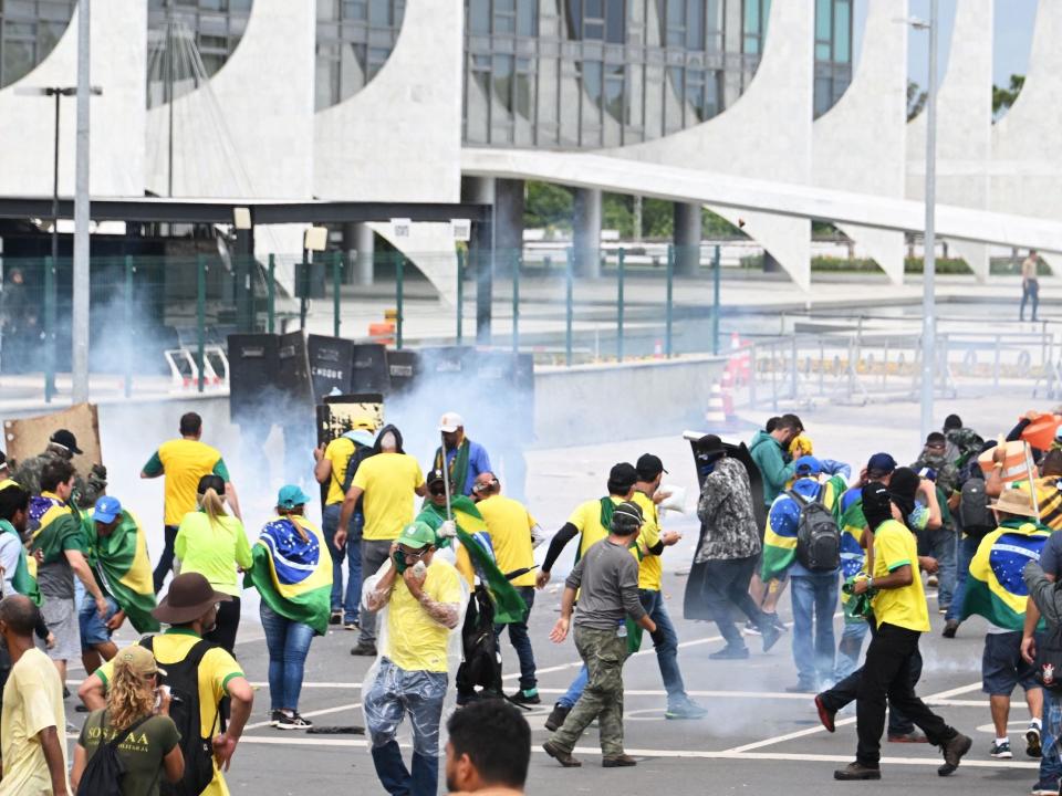 Brazilian police used tear gas Sunday to repel hundreds of supporters of far-right ex-president Jair Bolsonaro after they stormed onto Congress grounds