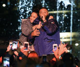 <p>The duo, who recently announced that they will be going on tour together, shared a snuggle on stage at the Fan Luv event at the Grove in L.A. on Thursday. (Photo: Kevin Winter/Getty Images) </p>