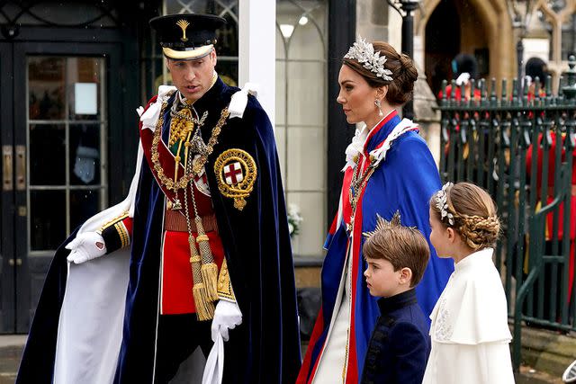<p>ANDREW MILLIGAN/POOL/AFP via Getty</p> From left: Prince William, Kate Middleton, Prince Louis and Princess Charlotte arrive for the coronation on May 6, 2023