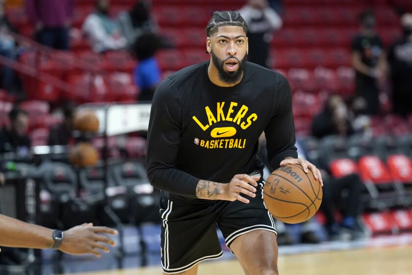 Los Angeles Lakers forward Anthony Davis warms up before an NBA basketball game.