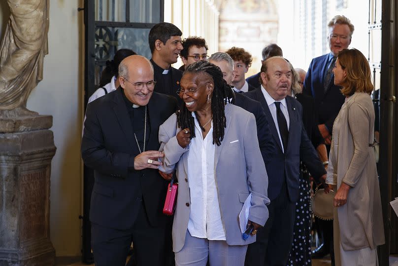 Whoopi Goldberg, centre, leaves after an audience with Pope Francis