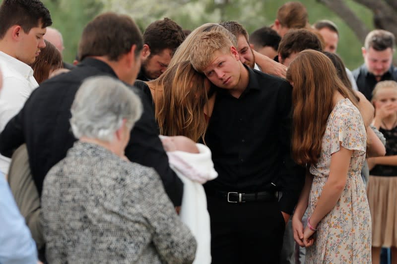 Relatives react during the funeral service of Dawna Ray Langford and her sons Trevor, Rogan, who were killed by unknown assailants, before buried at the cemetery in La Mora