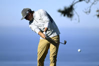 Rickie Fowler hits his tee shot on the 11th hole of the North Course at Torrey Pines during the first round of the Farmers Insurance Open golf tournament, Wednesday, Jan. 26, 2022, in San Diego. (AP Photo/Denis Poroy)