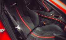<p>The carbon-fiber racing seats aren't the most comfortable design for a long haul, and if one were to attempt a coast-to-coast run in an 812, that's an option we'd avoid.</p>