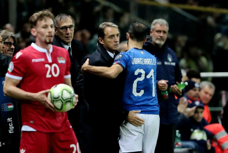 Italy's Fabio Quagliarella embraces coach Roberto Mancini as leaves the field during a Euro 2020 Group J qualifying soccer match between Italy and Liechtenstein, at the Ennio Tardini stadium in Parma, Italy, Tuesday, March 26, 2019. (Serena Campanini/ANSA via AP)