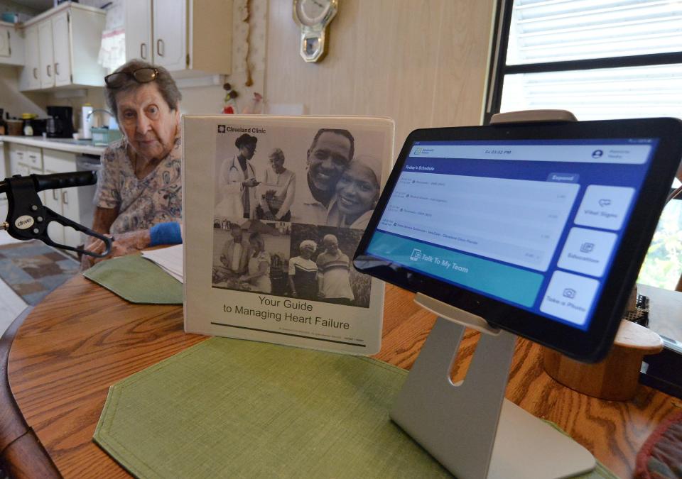 Patricia Yasky, 92, who has Type 1 diabetes and congestive heart failure, sits beside the Medically Home tablet that helped her stay connected to caregivers at Cleveland Clinic Indian River Hospital during her time as an inpatient in the new Care At Home program, Friday, Sept. 15, 2023, at the Fort Pierce, Fla., home she shares with son Michael Yasky. "I feel like I was losing my family," Patricia said upon discharge, reflecting on her close relationship with the nursing staff.