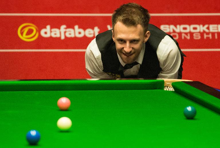 Judd Trump of England lines up a shot during the World Snooker Championship 2014 first round match on April 23, 2014