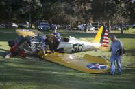 An airplane sits on the ground after crash landing at Penmar Golf Course in Venice, Los Angeles California March 5, 2015. Actor Harrison Ford was injured on Thursday in the crash of a small airplane outside Los Angeles, celebrity website TMZ reported. Reuters could not immediately confirm the report on TMZ, which said that Ford, 72, suffered multiple gashes to his head and was taken to a nearby hospital for treatment. (REUTERS/Lucy Nicholson)