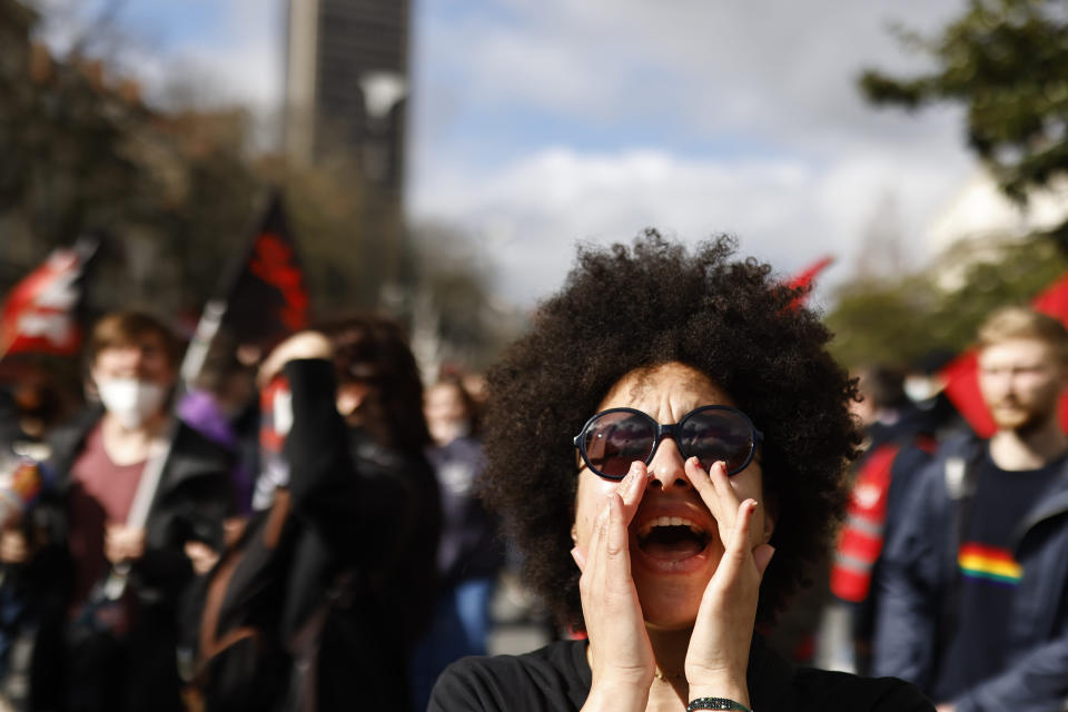 A protester screams during a demonstration in Nantes, western France, Saturday, March 18, 2023. A spattering of protests are planned to continue in France over the weekend against President Emmanuel Macron's controversial pension reform. (AP Photo/Jeremias Gonzalez)