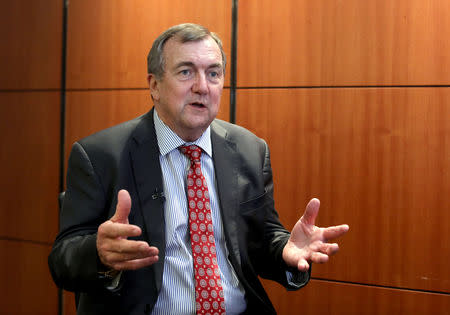 FILE PHOTO: Mark Bristow, chief executive officer of Barrick Gold, speaks during an interview at the Investing in African Mining Indaba conference in Cape Town, South Africa February 5, 2019. REUTERS/Mike Hutchings/File Photo