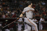 San Francisco Giants' Mike Yastrzemski follows through on a solo home run during the 11th inning of the team's baseball game against the Arizona Diamondbacks, Friday, Aug. 16, 2019, in Phoenix. It was Yastrzemski's third home run of the game. (AP Photo/Matt York)