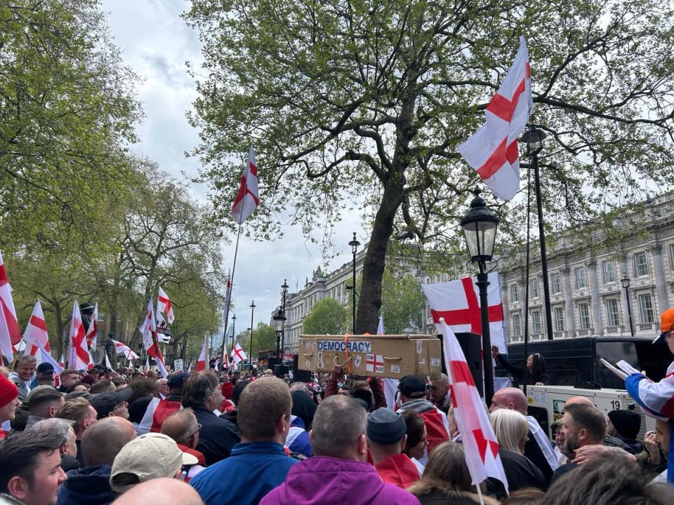 A coffin is carried through the crowd near Whitehall (Rachael Burford)
