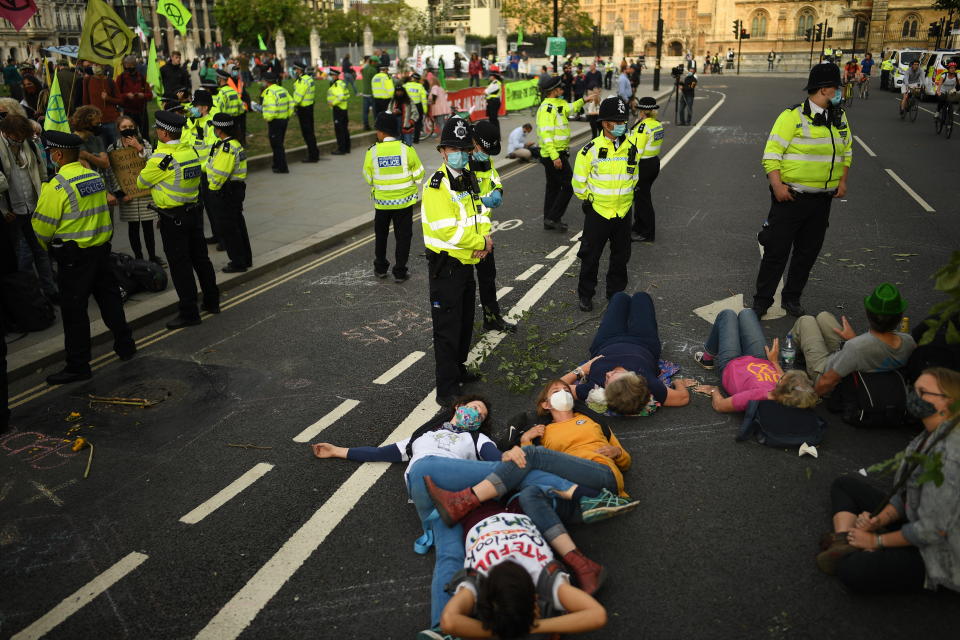 LONDON, ENGLAND - SEPTEMBER 01: Protestors block the road as Extinction Rebellion demonstrate in Westminster on September 1, 2020 in London, England. The environmental activist group organised several events across the UK timed for the return of government officials from the summer holiday. (Photo by Peter Summers/Getty Images)