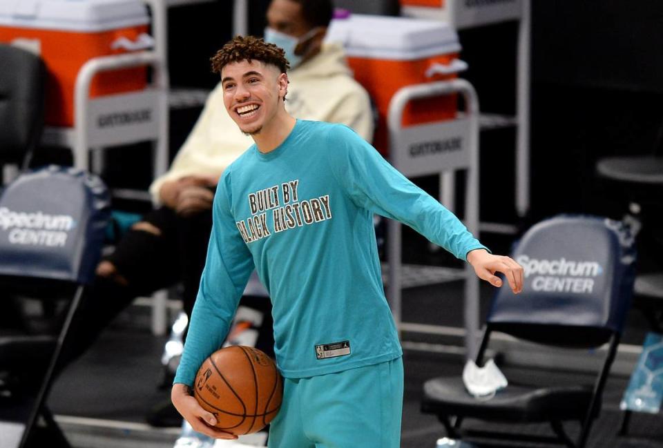 Charlotte Hornets guard LaMelo Ball jokes with his teammates prior a game against Philadelphia on Feb. 3rd, 2021.