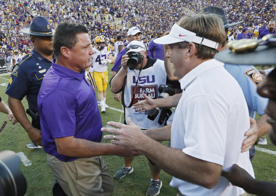 LSU coach Ed Orgeron, left, is congratulated by Georgia coach Kirby Smart after an NCAA college football game Saturday, Oct. 13, 2018, in Baton Rouge, La. (Bob Andres/Atlanta Journal Constitution via AP)
