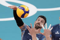 Argentina's Facundo Conte spikes a ball during a men's volleyball preliminary round pool B match against the United States, at the 2020 Summer Olympics, Sunday, Aug. 1, 2021, in Tokyo, Japan. (AP Photo/Manu Fernandez)