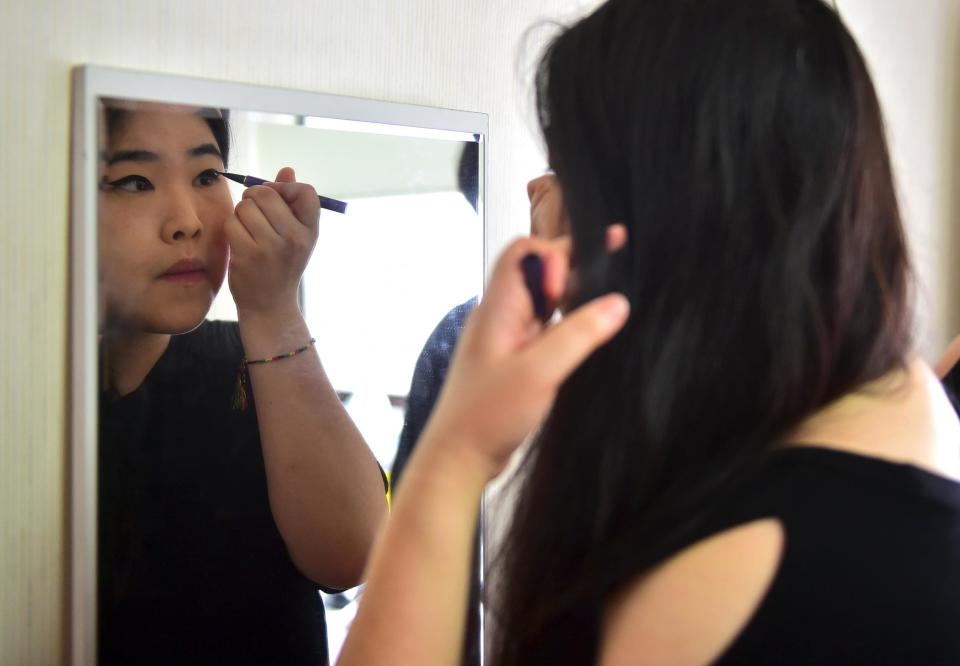 File photo: South Korean model Vivian Geeyang Kim has fronted campaigns to challenge "beauty norms" in the past. Now women in the country are joining a fight against trends in extreme make-up and cosmetic surgery in the pursuit of "perfect" body ideals: AFP/Getty/Jung Yeon-Je