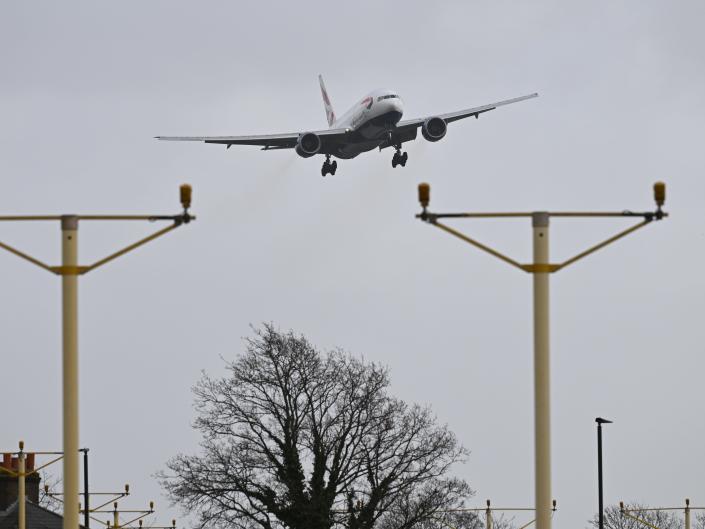 British Airways passenger plane struggles with the high winds on approach to Heathrow Airport on February 18, 2022 in Longford, England.  The Met Office has issued two rare, red weather warnings for the South and South West of England today as Storm Eunice makes landfall.  Much of the rest of the UK is under amber and yellow warnings with winds up to 100 mph, rain and snow expected.  This is the worst storm to hit the UK for three decades.  (Photo by Leon Neal/Getty Images)