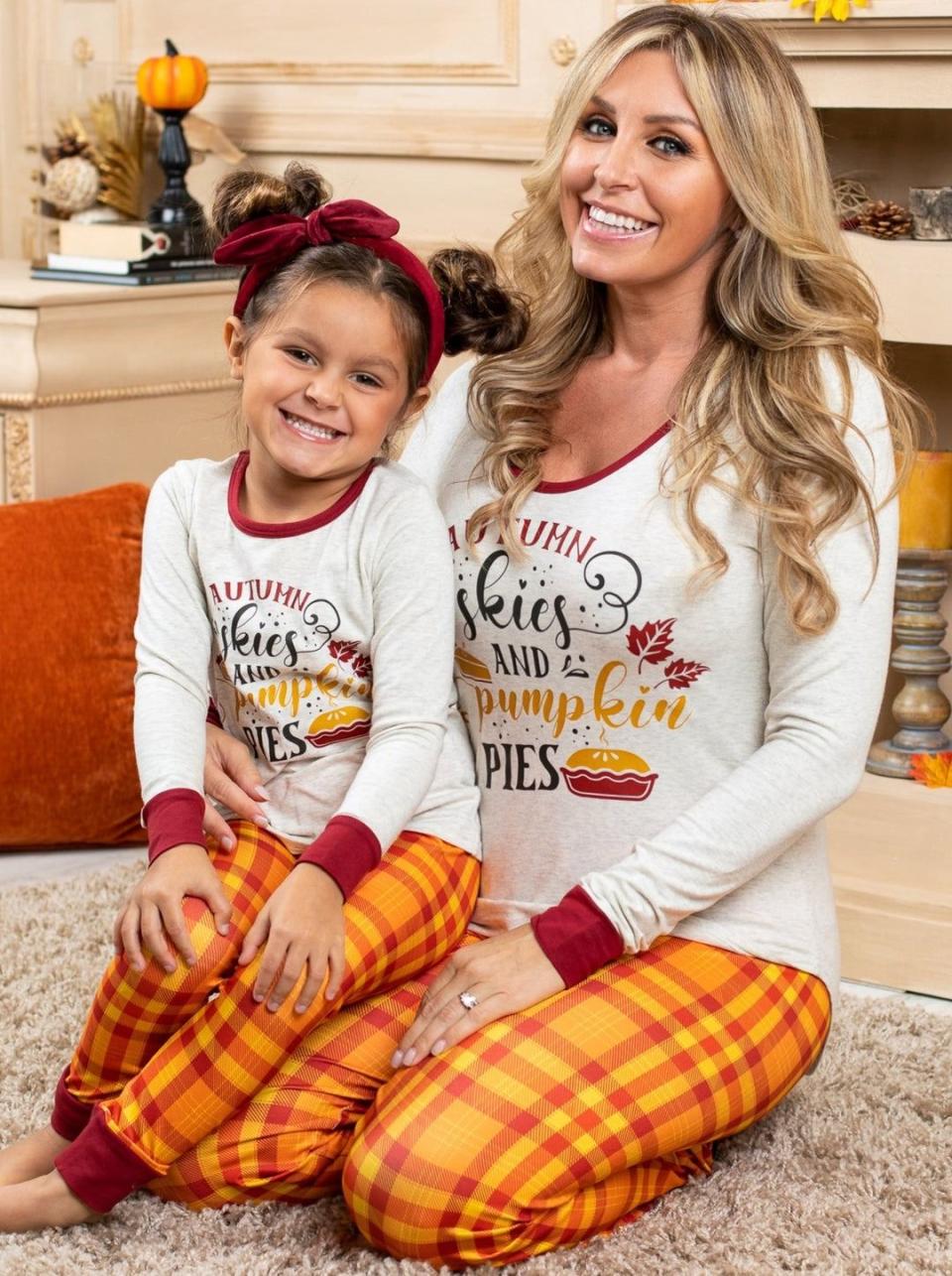 <p><a href="https://go.redirectingat.com?id=74968X1596630&url=https%3A%2F%2Fwww.miabellebaby.com%2Fcollections%2Fmommy-me-fall-pajama%2Fproducts%2Fmommy-and-me-autumn-skies-and-pumpkin-pies-long-sleeve-pajama-set&sref=https%3A%2F%2Fwww.thepioneerwoman.com%2Fholidays-celebrations%2Fg41461827%2Fthanksgiving-pajamas%2F" rel="nofollow noopener" target="_blank" data-ylk="slk:Shop Now;elm:context_link;itc:0;sec:content-canvas" class="link ">Shop Now</a></p><p>Mommy & Me Autumn Skies & Pumpkin Pies Pajama Set</p><p>miabellebaby.com</p><p>$34.99</p><span class="copyright">Mia Belle Girls</span>