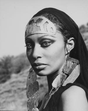 Donyale Luna in "Satyricon" 1969 wearing a gold headdress and veil.