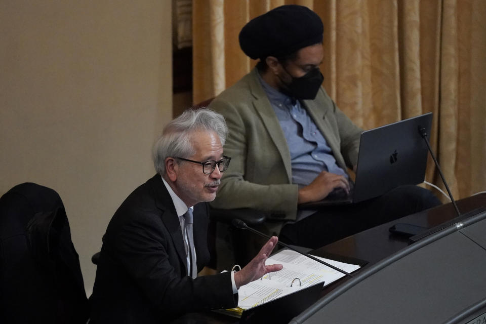 Task Force members Donald Tamaki, left, speaks next to Dr. Jovan Lewis during a meeting by the Task Force to Study and Develop Reparation Proposals for African Americans, Wednesday, Dec. 14, 2022, in Oakland, Calif. (AP Photo/Jeff Chiu)