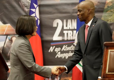 Taiwan's President Tsai Ing-wen shakes hands with Haiti's President Jovenel Moise after a news conference at the National Palace during her one day visit to Haiti, in Port-au-Prince