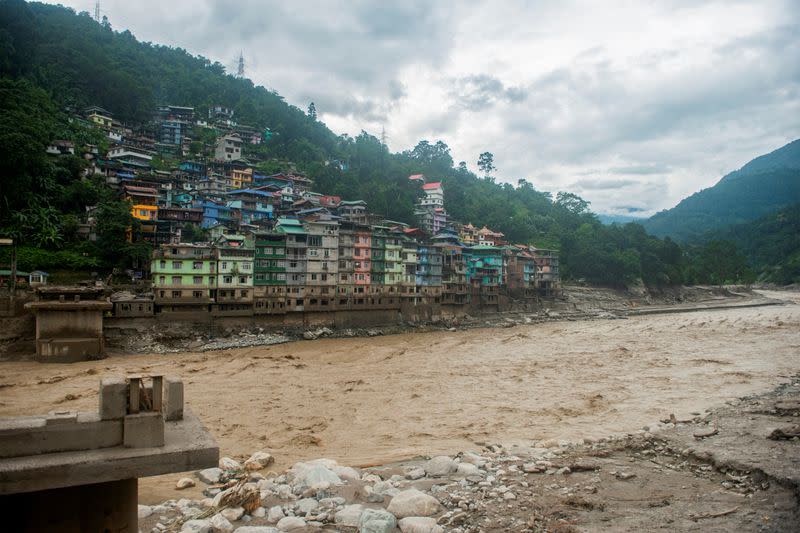Remains of the bridge connecting Adarsh gaon with Singtam is pictured along the bank of Teesta River at Singtam in Sikkim