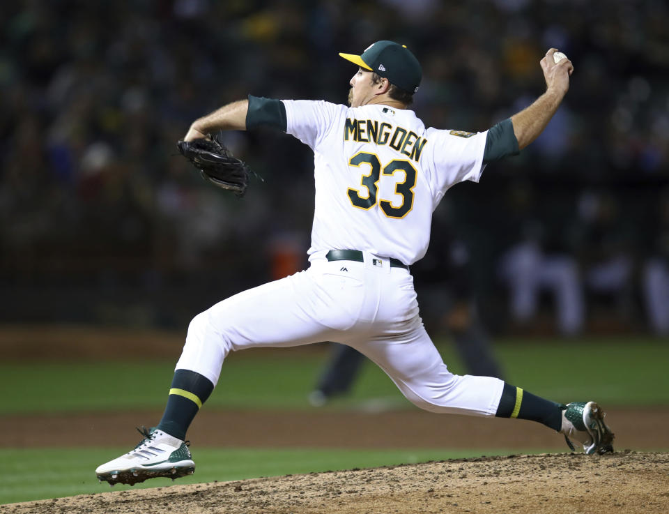 Oakland Athletics pitcher Daniel Mengden works against the New York Yankees in the fourth inning of a baseball game Tuesday, Sept. 4, 2018, in Oakland, Calif. (AP Photo/Ben Margot)