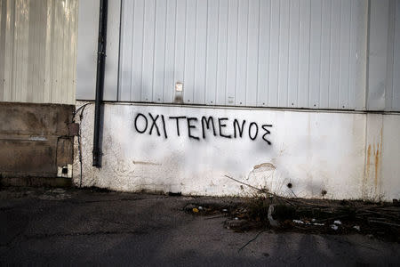 A slogan reads "No Mosque" on a building wall next to the construction area of the first formal mosque in Athens, Greece, February 6, 2017. REUTERS/Alkis Konstantinidis