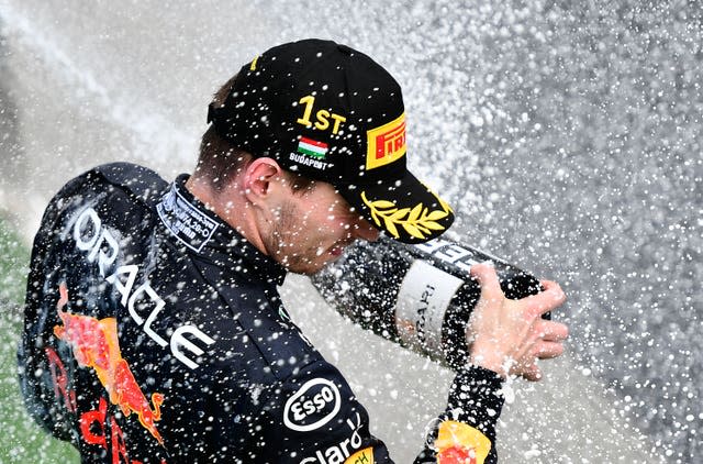 Max Verstappen of the Netherlands sprays champagne on the podium after winning the Hungarian Grand Prix