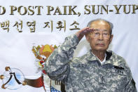 Former South Korean army Gen. Paik Sun-yup salutes during a ceremony at the New Mexico Range in Paju, South Korea on Aug. 29, 2013. Paik who was celebrated as a major war hero for leading troops in several battle victories against North Korean soldiers during the 1950-53 Korean War, has died. He was 99. (Yonhap via AP)