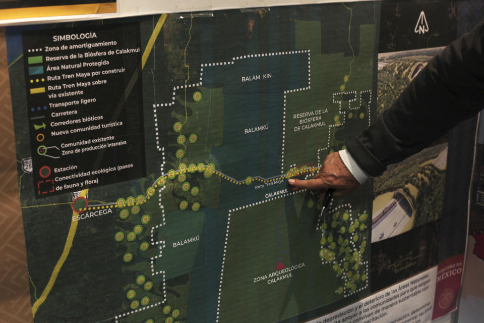 FILE - Rogelio Jiménez Pons, director of Fonatur, points to a map of a planned tourist train line through the Yucatan Peninsula known as the Maya Train, during an interview in Mexico City, March 18, 2019. Mexico’s president on Dec. 15, 2023 inaugurated the first part of this project of his administration. (AP Photo/Marco Ugarte, File)