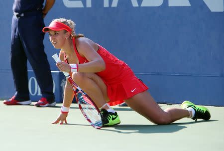 Sep 7, 2015; New York, NY, USA; Sabine Lisicki of Germany stretches between points in the third set of her match against Simona Halep of Romania on day eight of the 2015 U.S. Open tennis tournament at USTA Billie Jean King National Tennis Center. Mandatory Credit: Jerry Lai-USA TODAY Sports