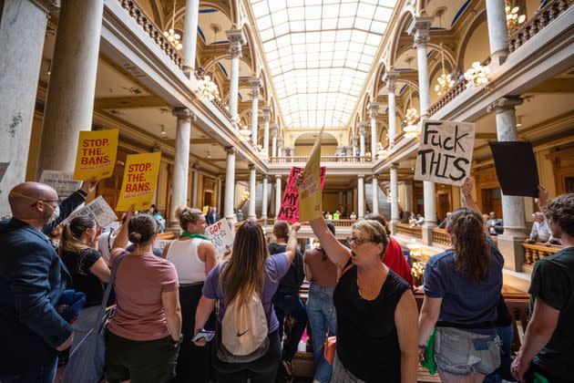 Anti-abortion and abortion rights activists protest on multiple floors of the Indiana State Capitol rotunda on Monday. (Photo: Jon Cherry via Getty Images)