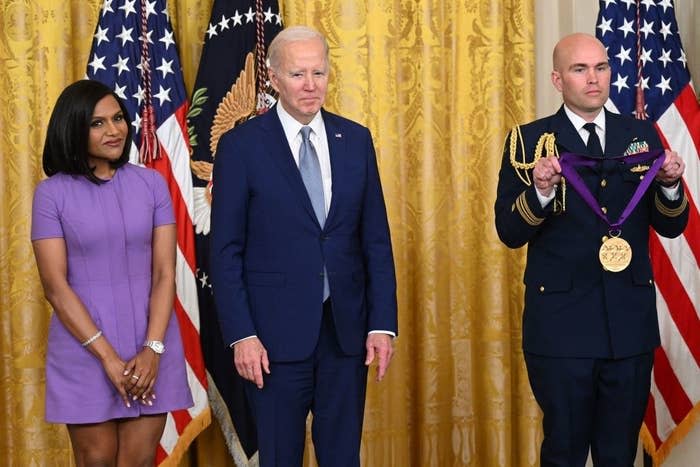 From left to right: Mindy, President Biden and a military official holding Mindy's medal