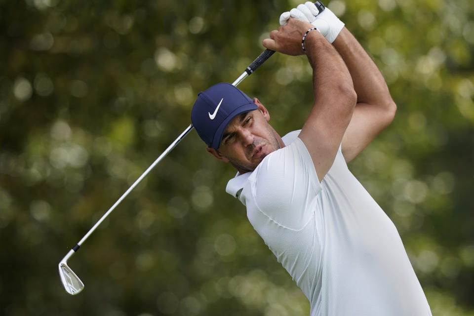 Brooks Koepka hits from the tee on the third hole during second-round play in the Tour Championship golf tournament at East Lake Golf Club, Friday, Sept. 3, 2021, in Atlanta. (AP Photo/Brynn Anderson)