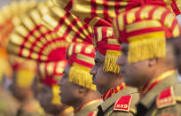 An Indian Sashastra Seema Bal paramilitary soldier breathes through mouth as he participates in a parade to mark Republic Day in Gauhati, India, Sunday, Jan. 26, 2020. Sunday's event marks the anniversary of the country's democratic constitution taking force in 1950. (AP Photo/Anupam Nath)