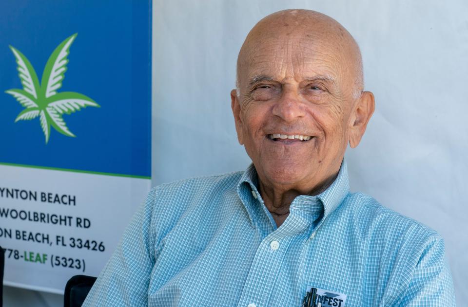 Dr. George Andricopoulos, a physician with Releaf Medical in Boynton Beach, was stationed at a booth at SunFest registering people for medical marijuana cards Saturday.