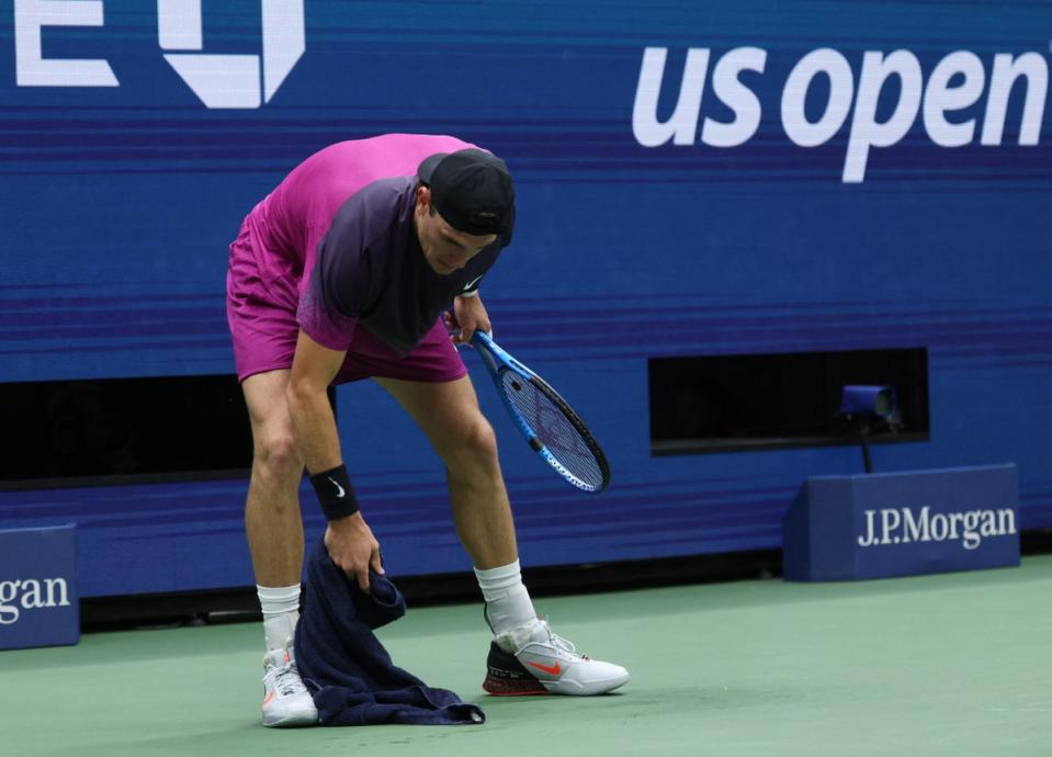 Draper wiped away his vomit on court (REUTERS)