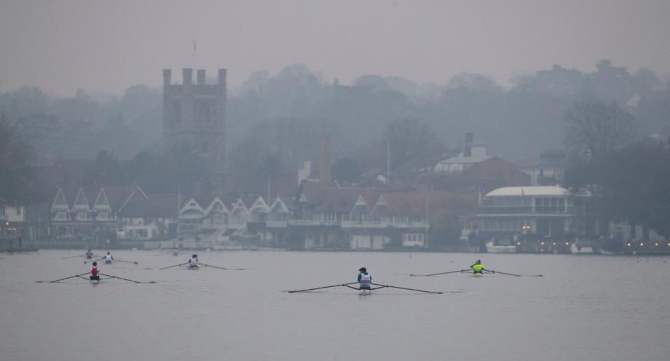 Rowers in the early morning mist in Henley-on-Thames, Berkshire, on Monday. (PA)