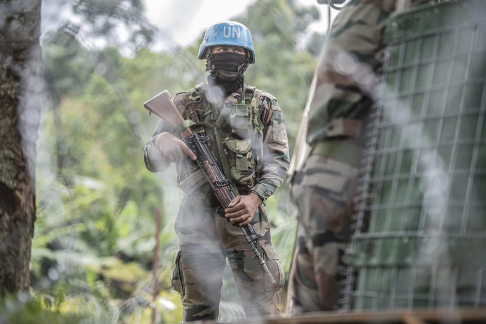 MONUSCO blue helmet deployed near Kibumba, north of Goma, Democratic Republic of Congo, Saturday Jan. 28, 2022. Thousands of people in the Democratic Republic of Congo have been displaced after they fled ongoing clashes between the Congolese army and M23 fighters this week. (AP Photo/Moses Sawasawa)